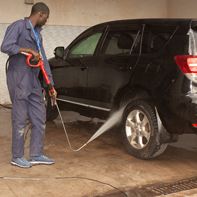 Man spray washing car